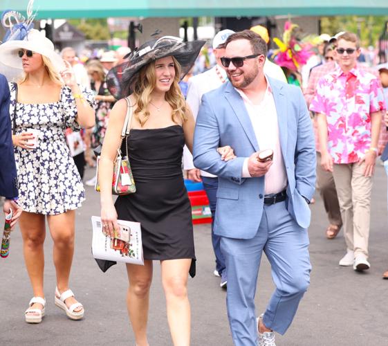 Couple walks into Churchill Downs.JPG