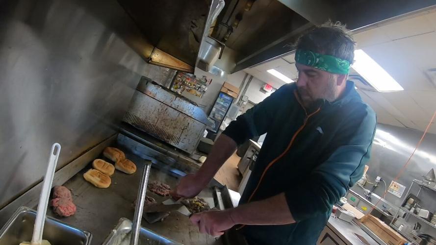 Matt Rich prepares food at Gourmet Provision restaurant on Westport Road