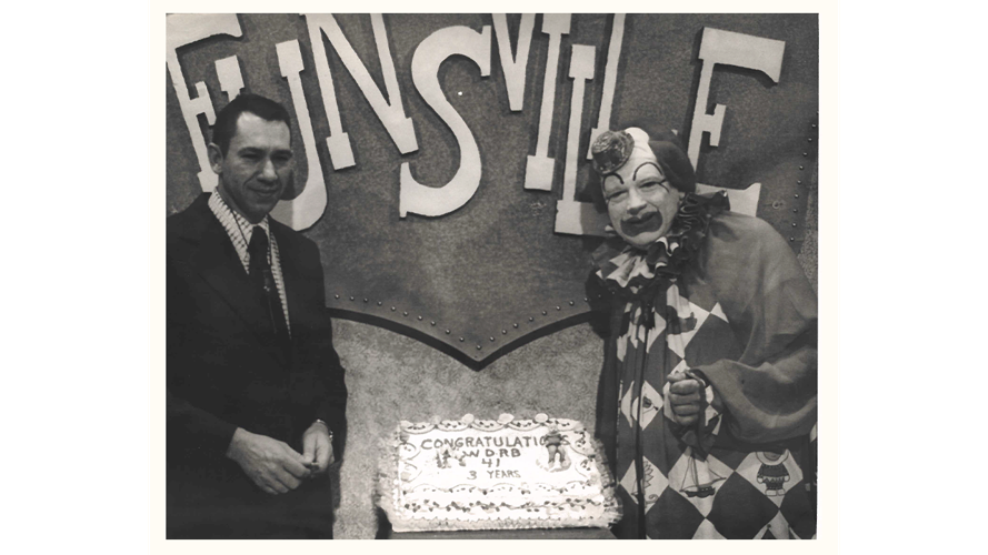 Presto on set of Funsville with cake