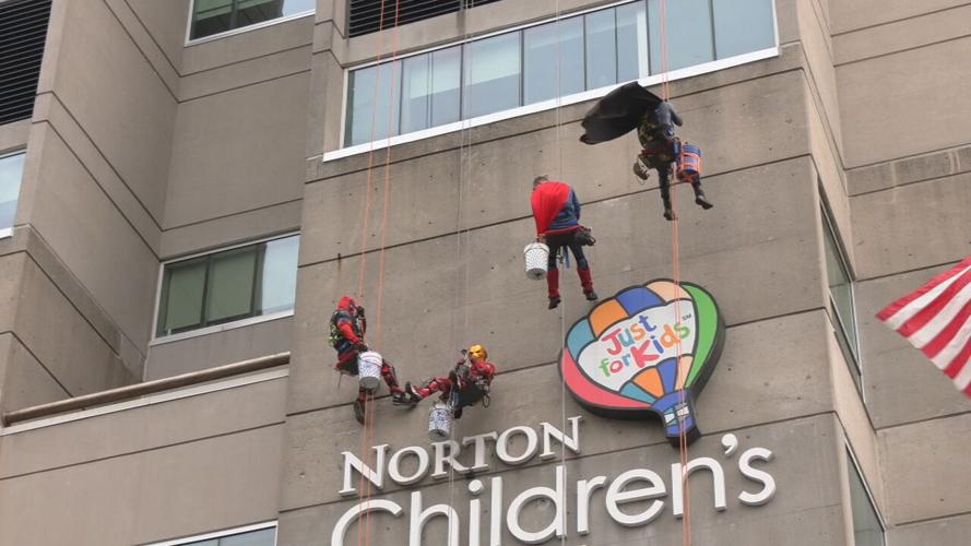 Window washers rappel from Norton Children's Hospital dressed as superheroes