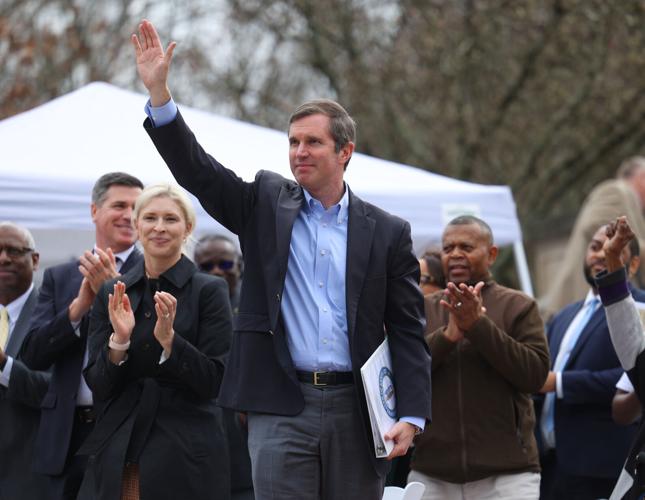 Gov. Andy Beshear waves to crowd.JPG