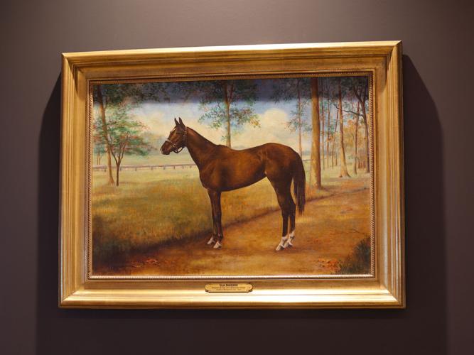 Horse painting at Woodford Reserve club seating.JPG