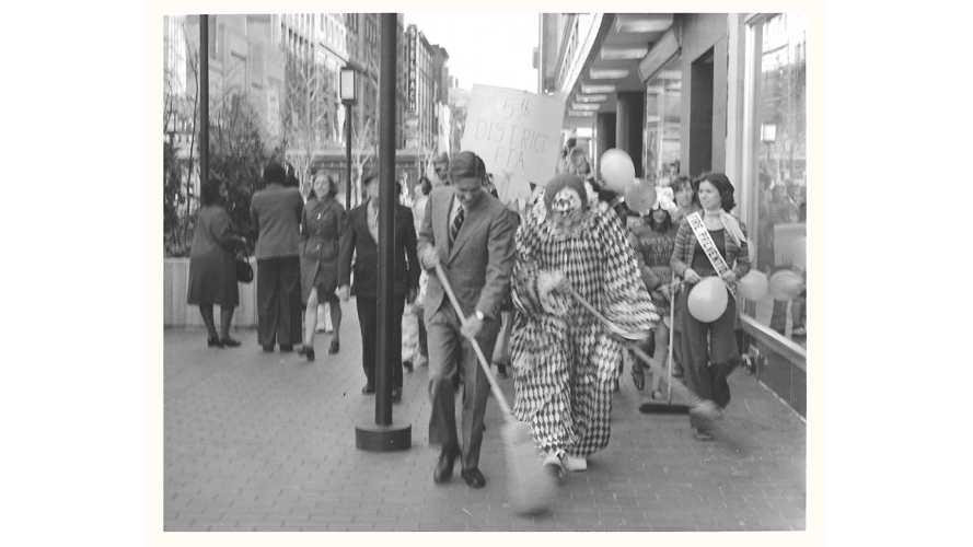 Presto the Magic Clown in downtown Louisville with broom