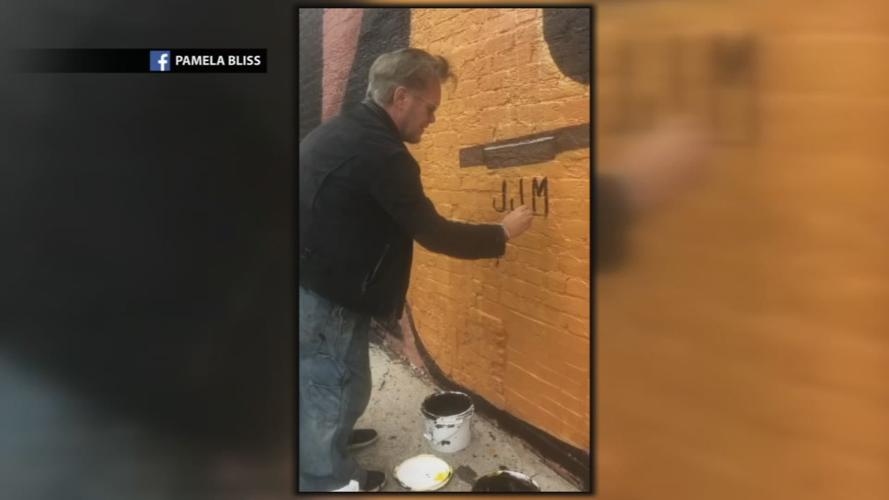 John Mellencamp signs Seymour mural.jpg