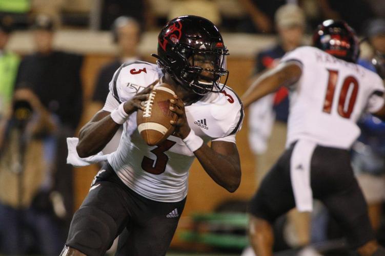 Louisville quarterback Malik Cunningham looks to pass