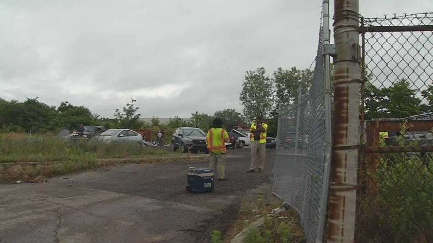 People pick up belongings from Louisville Metro Solid Waste Management