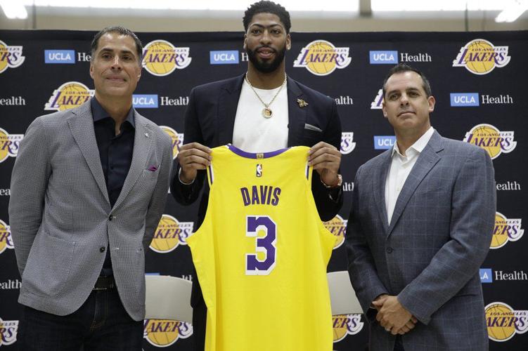 Rob Pelinka, left, and Head Coach Frank Vogel, right, introduce Anthony Davis