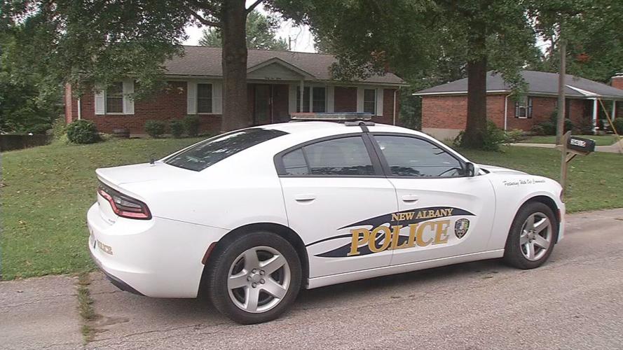New Albany Police outside Judson and Rebecca Hoover's home.jpeg