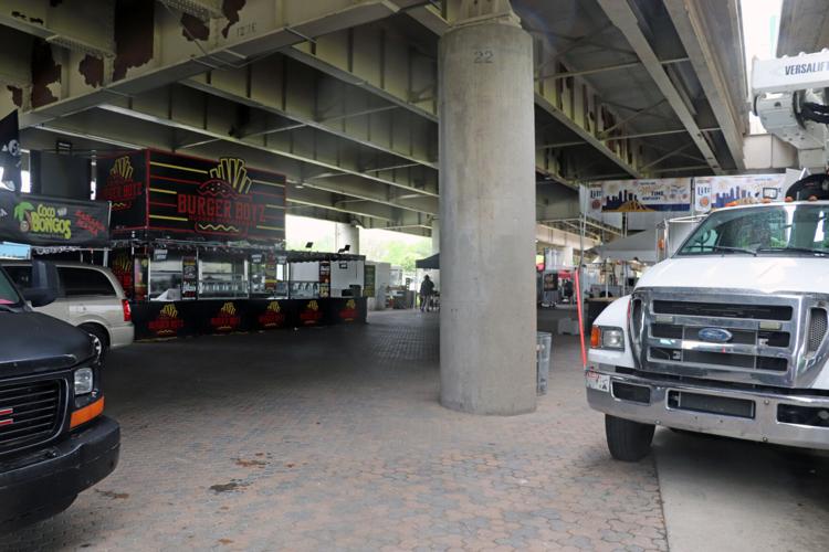 Crews set up booths along the Ohio River one day before Thunder Over Louisville 2023