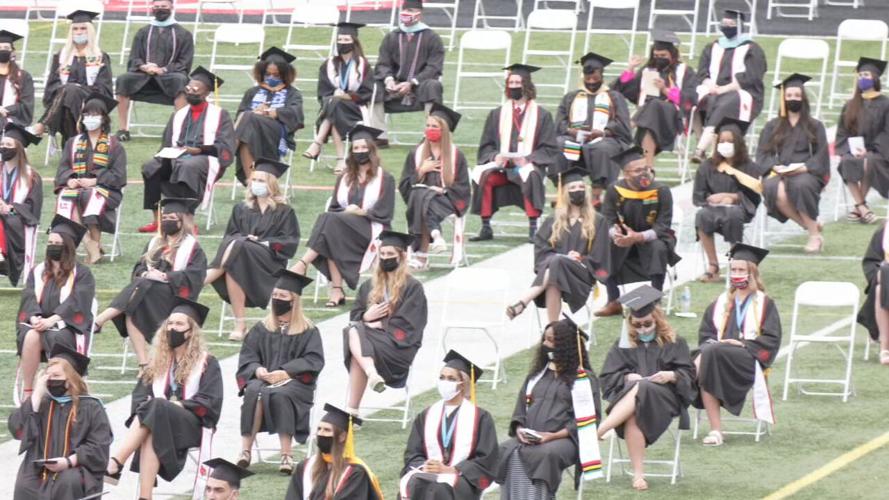 Graduates at Cardinal Stadium ceremony.jpeg