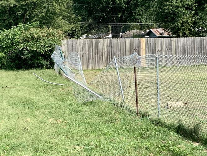 A damaged fence at the scene near Gordon Drive in New Albany where police shot a man on Sept. 12, 2020