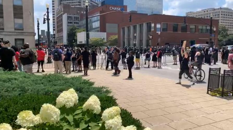 Protesters begin to gather downtown on July 25, 2020 ahead of NFAC arrival