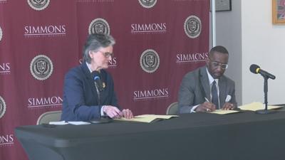 Simmons, Spalding sign agreement