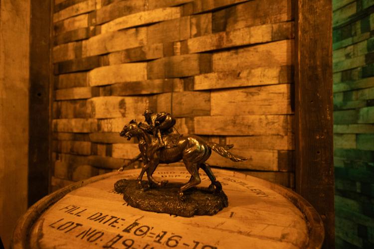 Small horse and jockey statue at Churchill Downs.jpeg