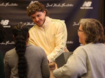 Jack Harlow shakes a person's hands.JPG
