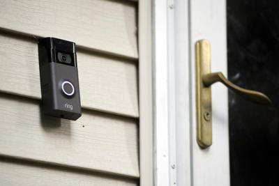 A Ring doorbell camerea is displayed outside of a home.jpeg