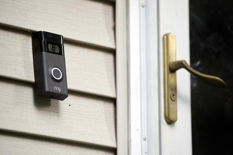 A Ring doorbell camerea is displayed outside of a home.jpeg