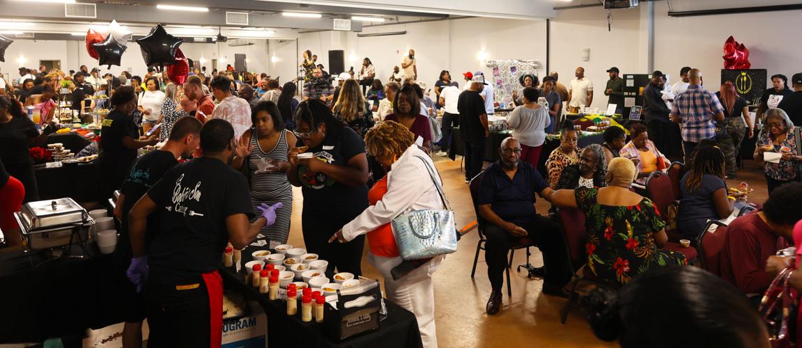 People stand at Taste of West Louisville.JPG