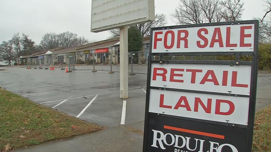 For sale sign at St. Matthews strip mall