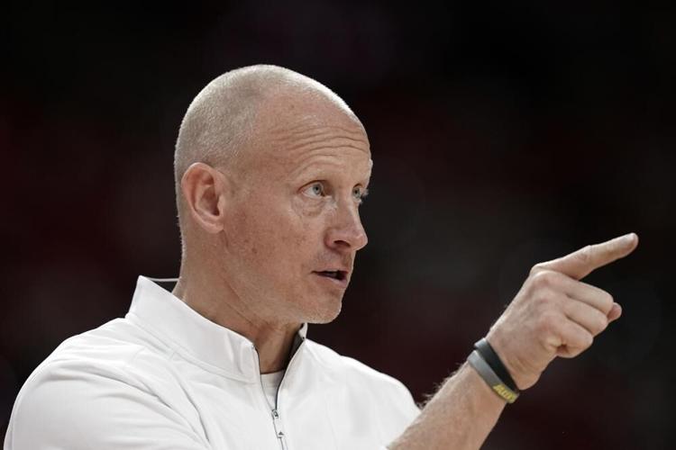 Louisville head coach Chris Mack directs his team during the second half against NC State.jpeg