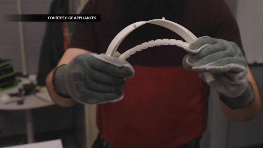 GE Appliances face shields in hand.jpg