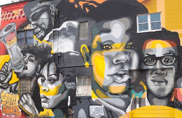 Faces of those killed in Louisville mural.JPG
