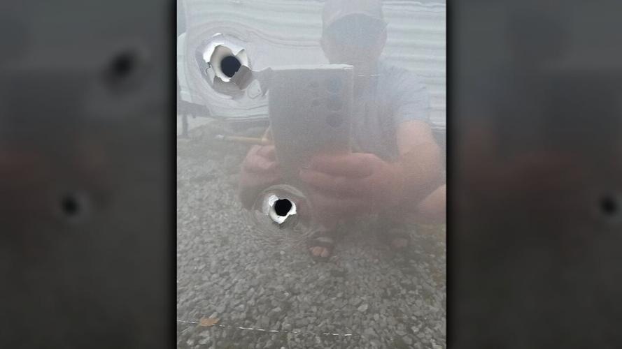 Bullet holes in car shot on Baxter Avenue