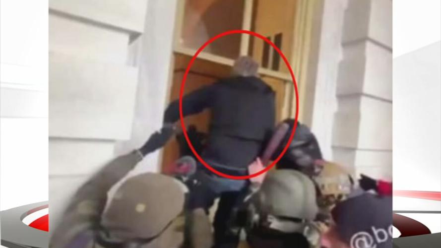 Man breaking into Capitol window