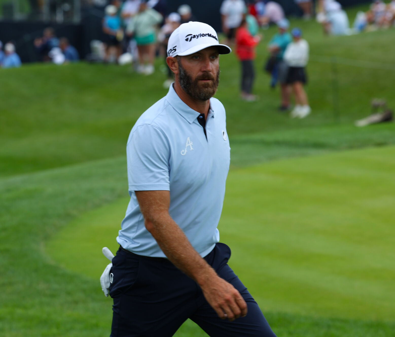 Dustin Johnson walks to 13th tee box.JPG
