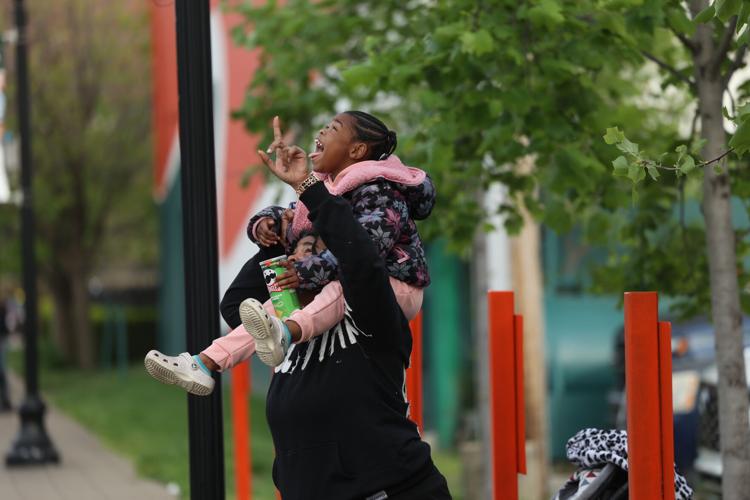 Child watches planes fly.JPG