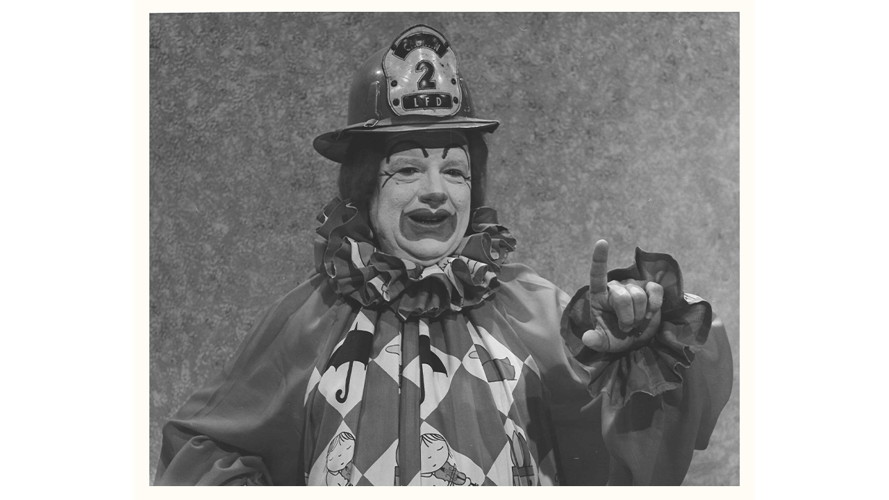 Presto the Magic Clown with fireman's hat