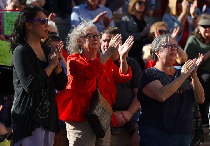 Group of women cheer during vigil.JPG