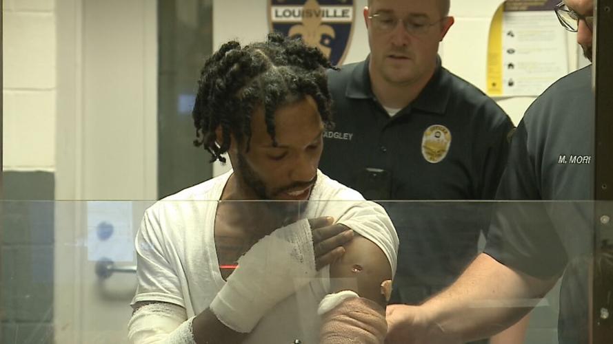Herbert Lee shows off gunshot wound during July 15, 2022 arraignment