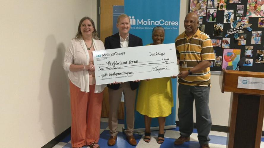 Passport Health Plan $10,000 donation to Neighborhood House