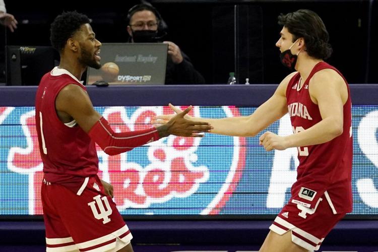 Indiana guard Al Durham, left, celebrates with guard Trey Galloway