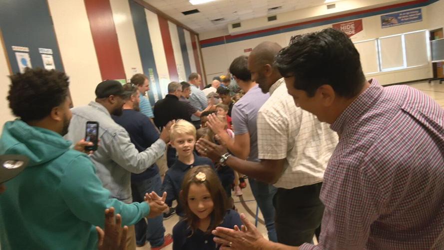 'Flash dads' greet JCPS students before classes at Audubon Elementary School