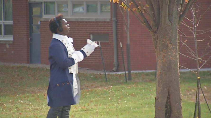 Performing 'Hamilton' hits, Male High School grad turns street into stage