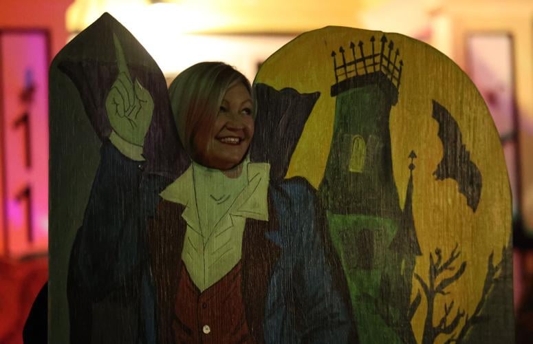 A woman takes a photo on Hillcrest.JPG