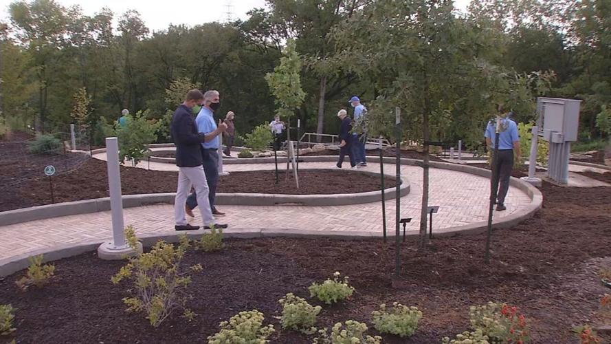 People walk on Beargrass path at Waterfront Botanical Gardens