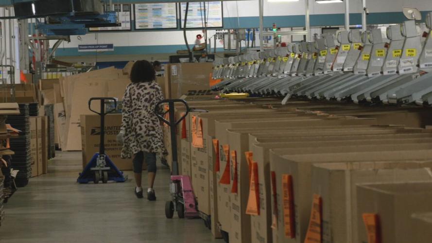 Worker at US Post Office on Gardiner Lane in Louisville