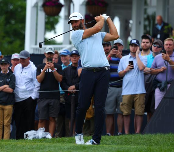Dustin Johnson practices on 13th tee box.JPG