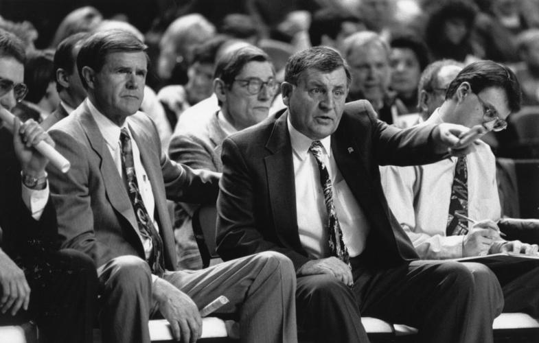 Jerry Jones on bench w Denny Crum.jpg