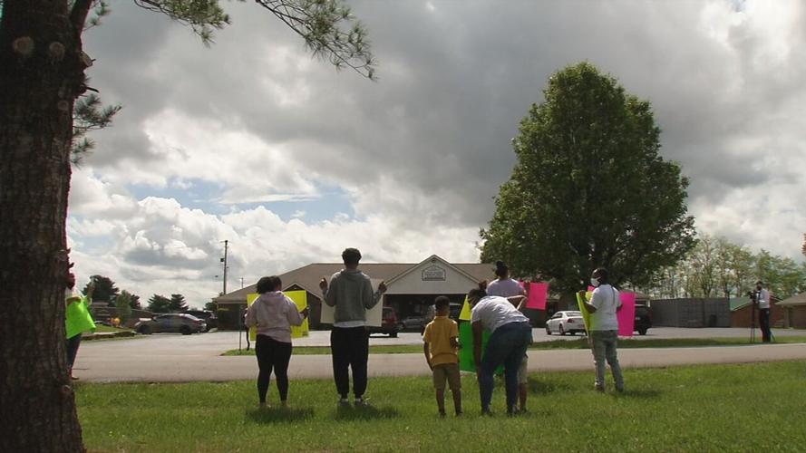 Protesters gather outside Little Angels Primary House