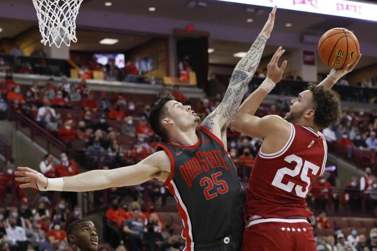Indiana's Race Thompson shoots over Ohio State's Kyle Young.jpeg