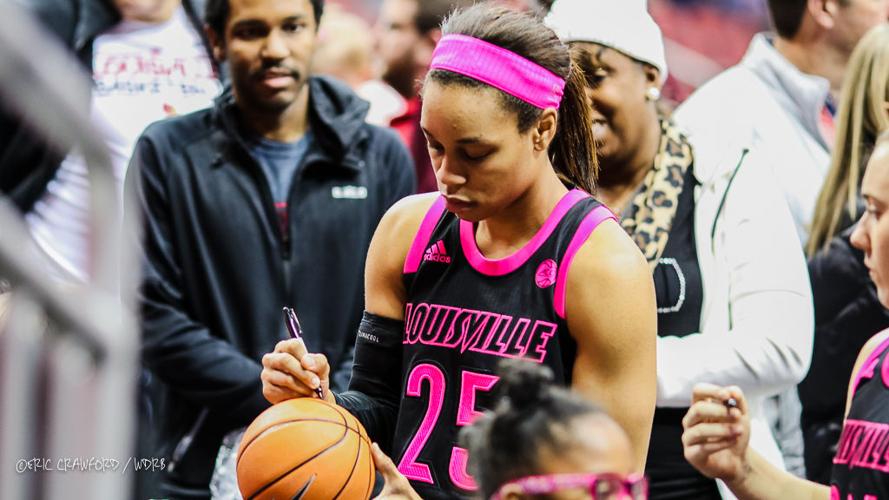Asia Durr signs autographs after a loss