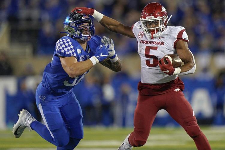 Arkansas running back Rakeem Boyd (5) runs with the ball