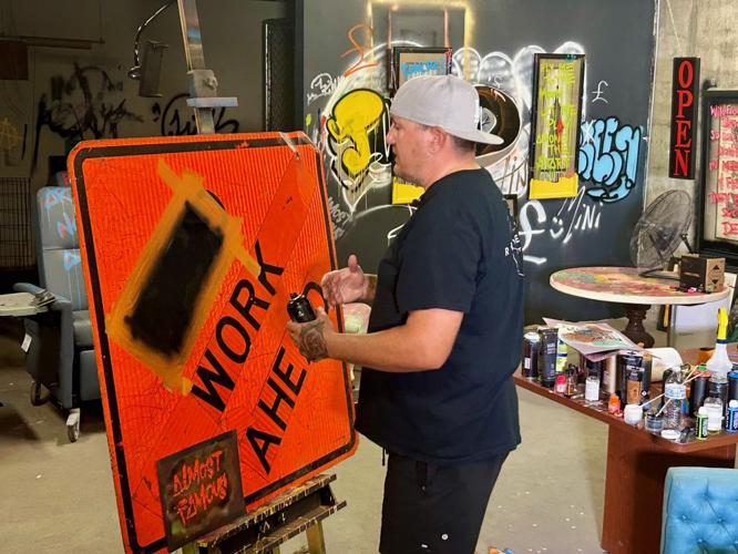 Jason Lois works on art.jpg