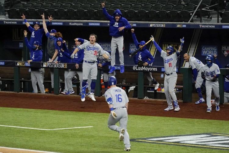 The Los Angeles Dodgers celebrate a three-run home run by Will Smith