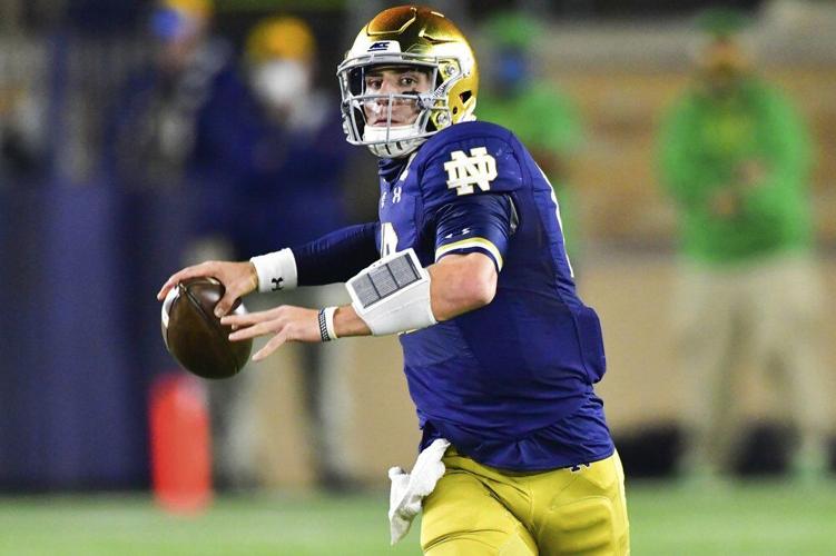Notre Dame quarterback Ian Book looks for a receiver during the first quarter against Clemson