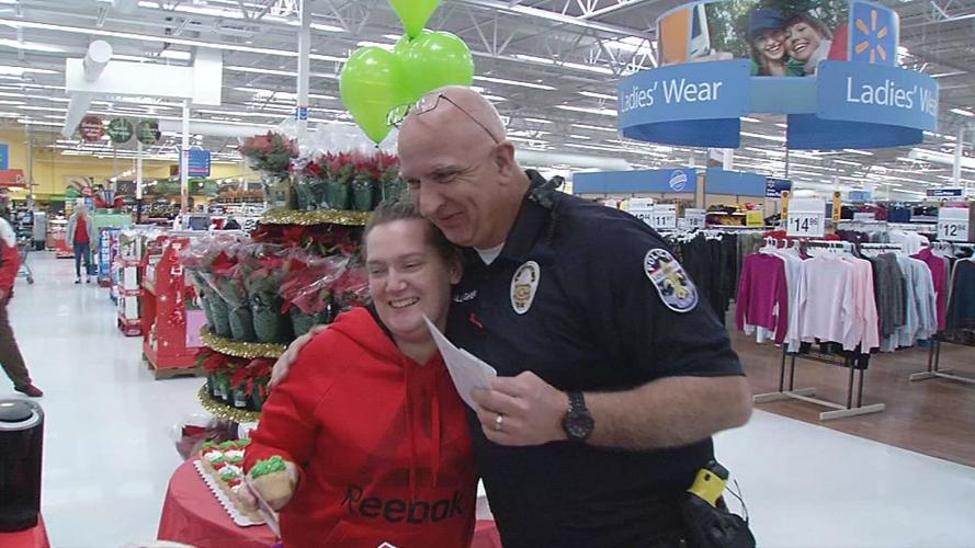 Metro Police Officers surprise Walmart shoppers with gift cards